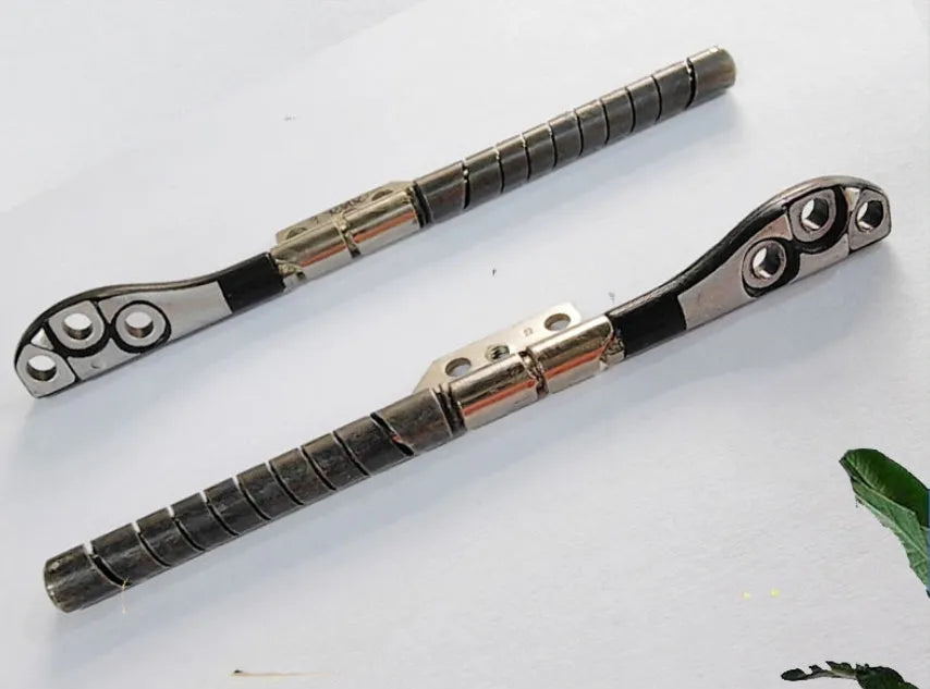 Pair of silver laptop screen hinge shafts for Apple MacBook Pro 15-inch A1286 model.