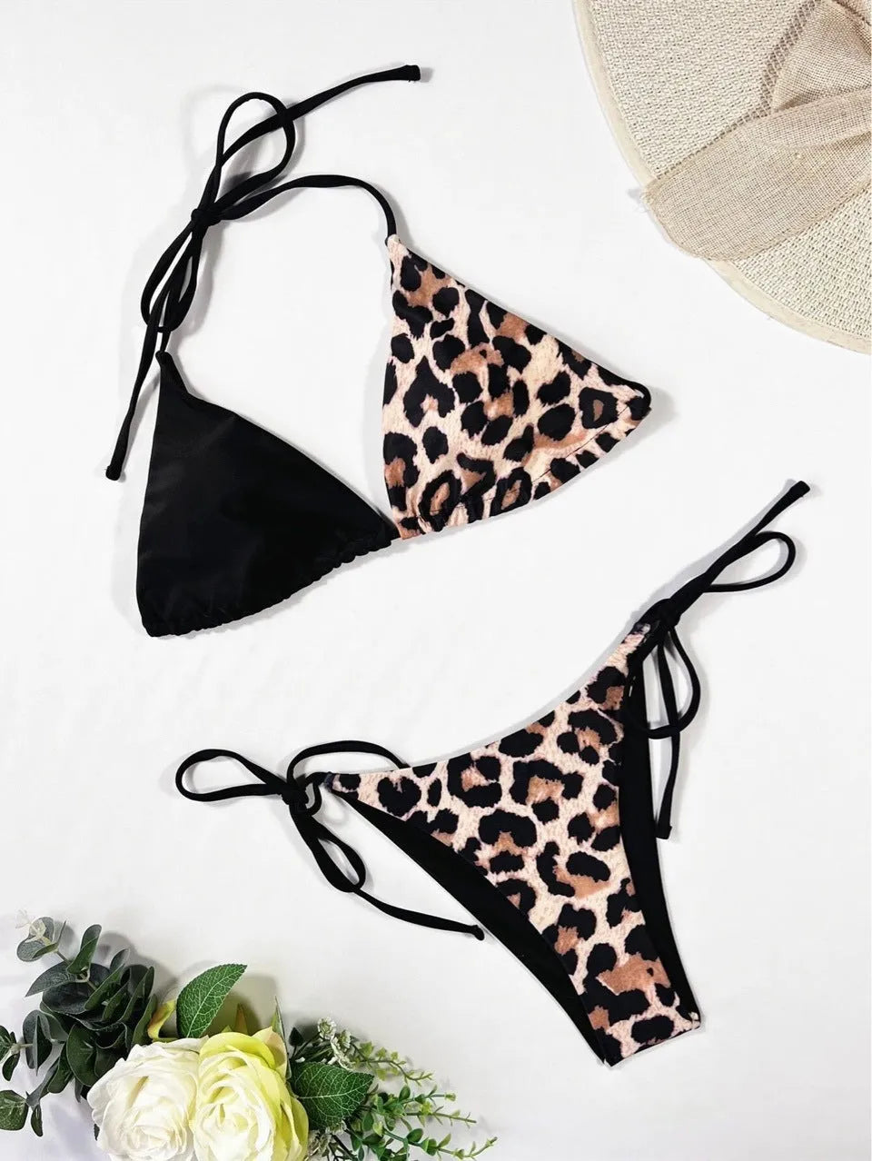 Women's red leopard print bikini with halter neck lace-up top and high-waisted bottoms.