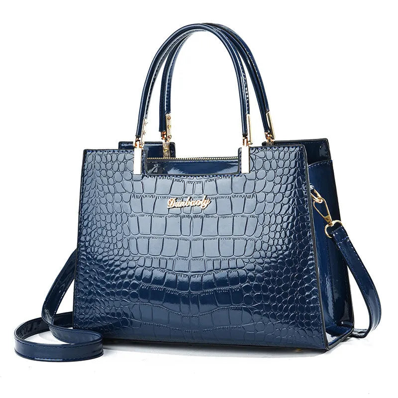 Square-shaped one-shoulder PU leather handbag in medium-hard construction showing colour options.
