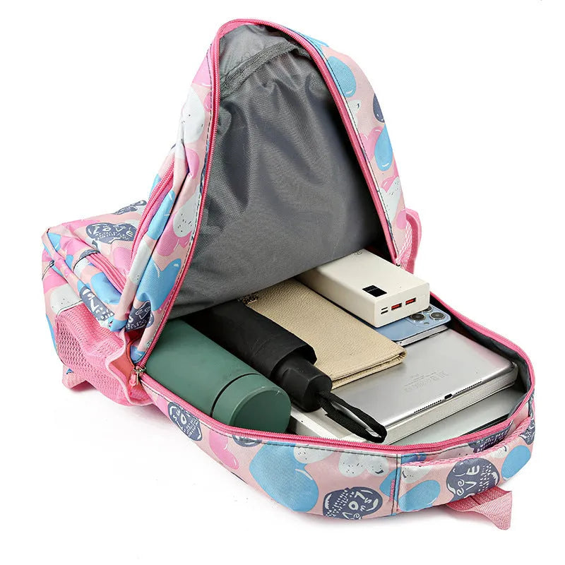 Blue student backpack with air pillow shoulder straps and large main compartment.
