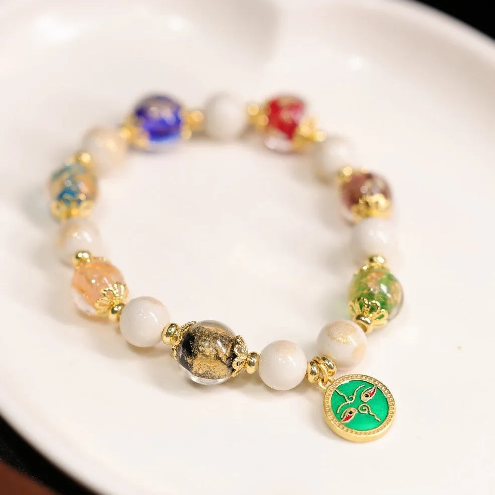 Handmade coloured glaze bracelet with 10mm glass beads showing gods of wealth motifs in national style design