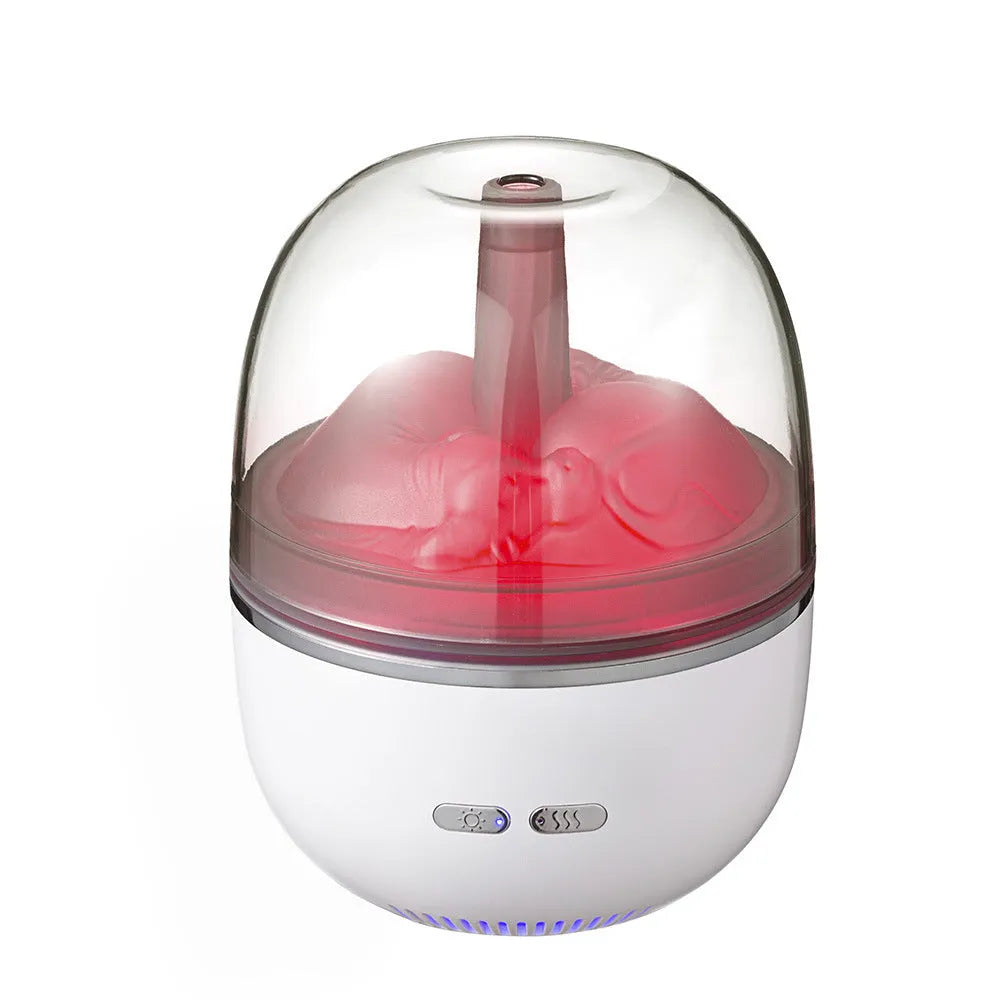 Green ultrasonic aromatherapy humidifier with heavy fog and colourful gradient light on a desk