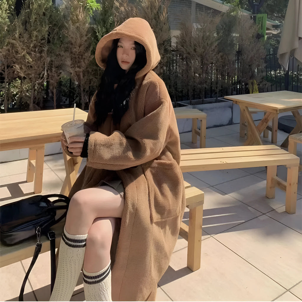 Women's mid-length lamb wool coat in apricot with horn button front closure