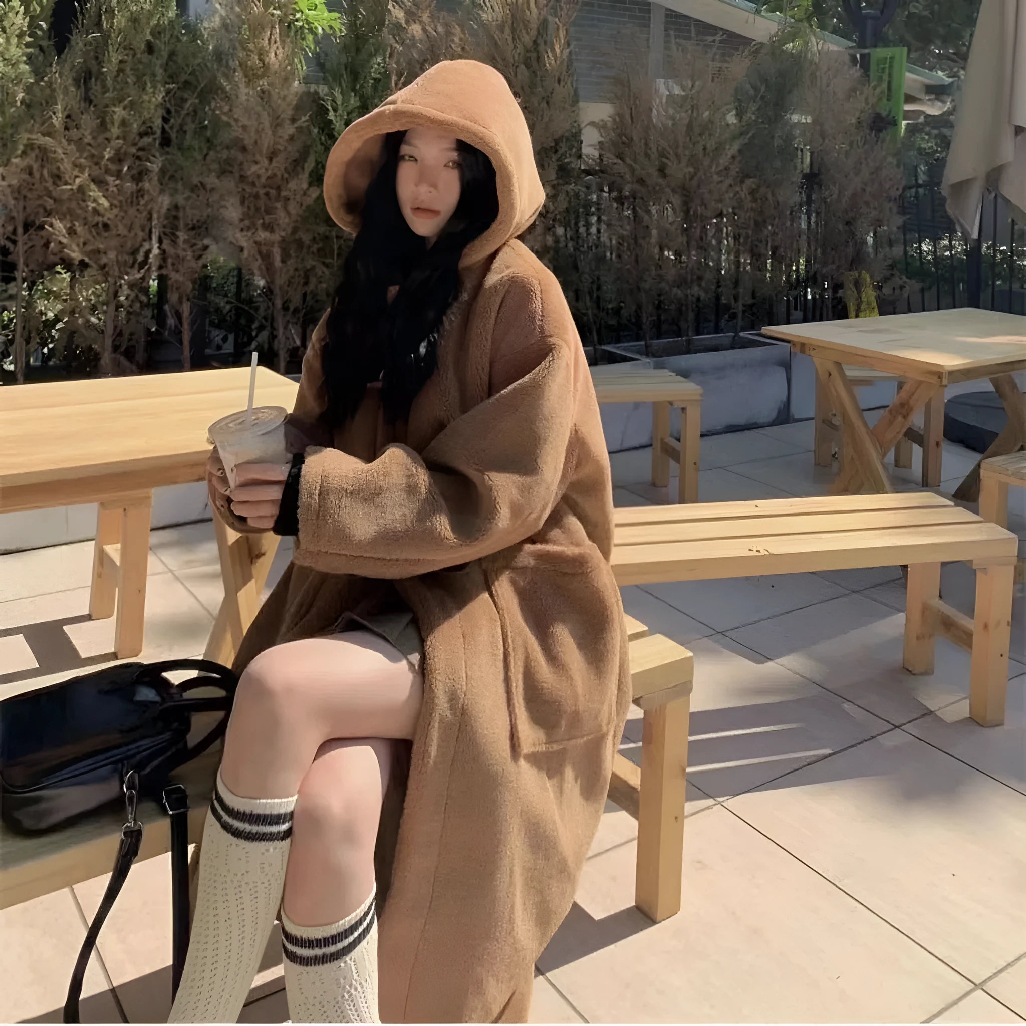 Women's mid-length lamb wool coat in apricot with horn button front closure