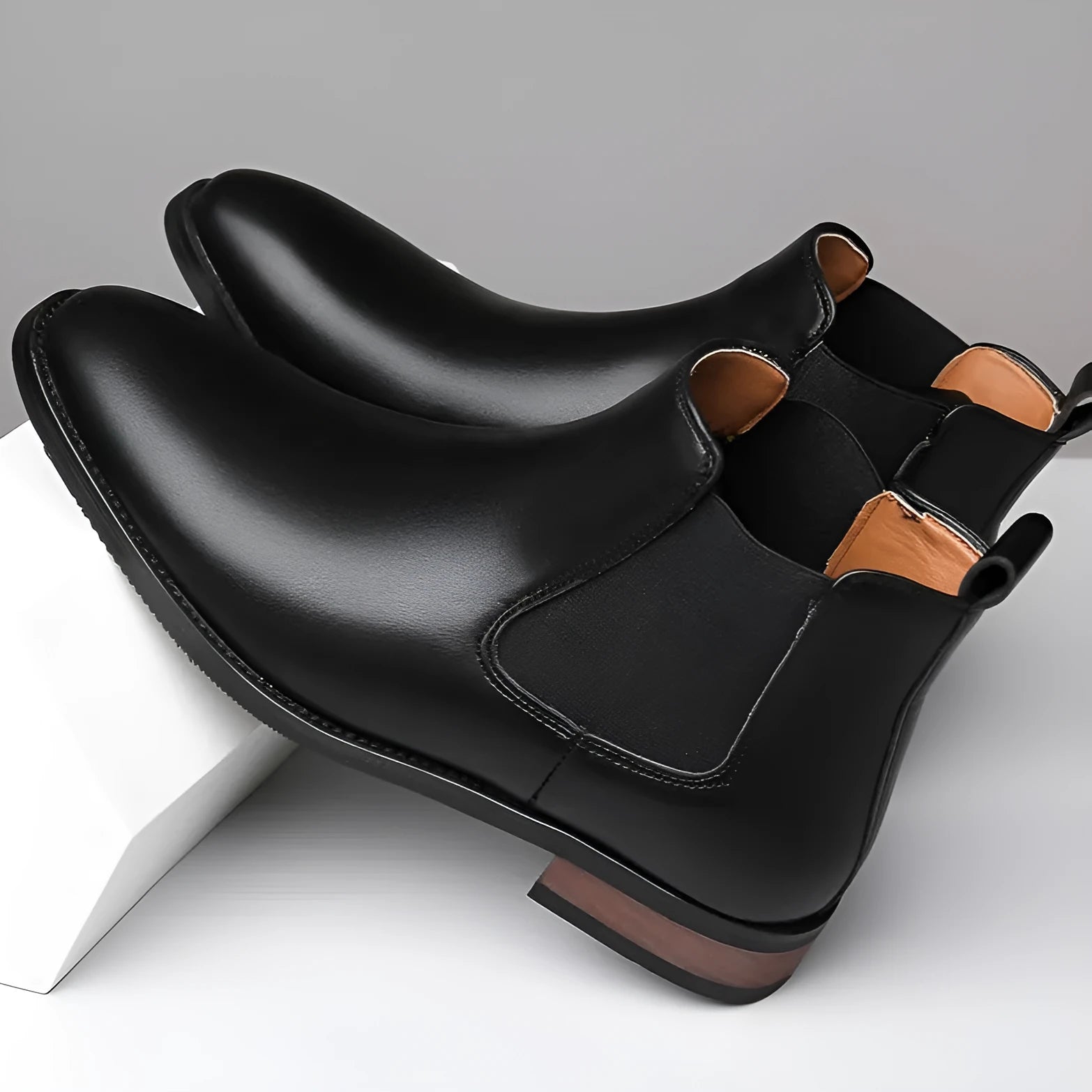 Men's black and light brown Chelsea boots with pointed toe and artificial PU upper