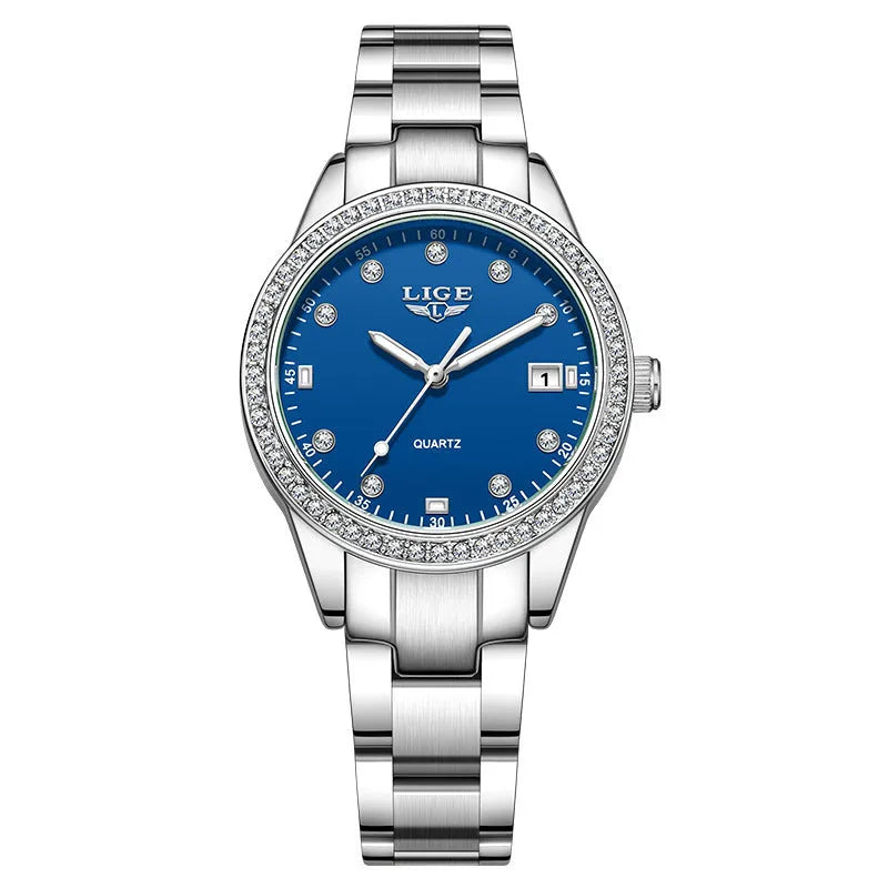 Silver stainless steel women's watch with diamond-encrusted bezel and luminous hands on a 34mm round dial.