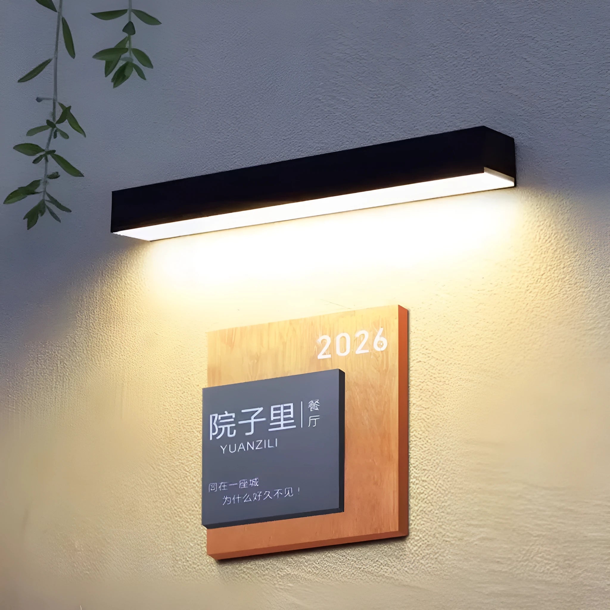 Black solar-powered outdoor wall lamp with IP65 rating for garden installation