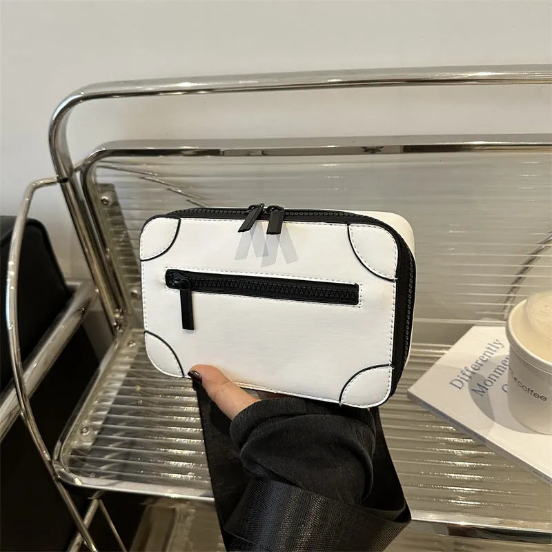 Women's small square crossbody bag in PU leather, horizontal shape, shown in one of five colours with visible sewing lines.