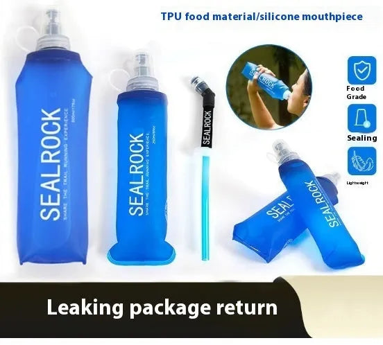 Mountain Cliking portable plastic straw with black clip attached to a green backpack strap