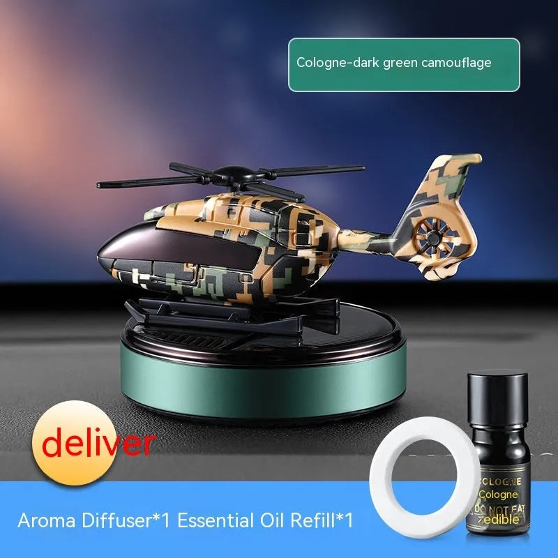 Solar-powered camouflage design car perfume and decoration unit on a car dashboard.