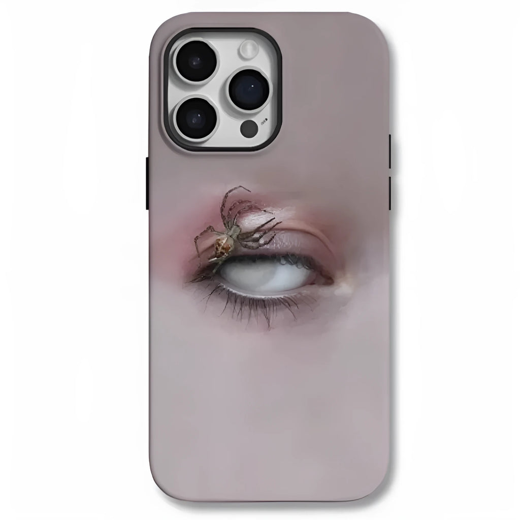 Dark frosted iPhone case with a spider web pattern, shown protecting a mobile phone.