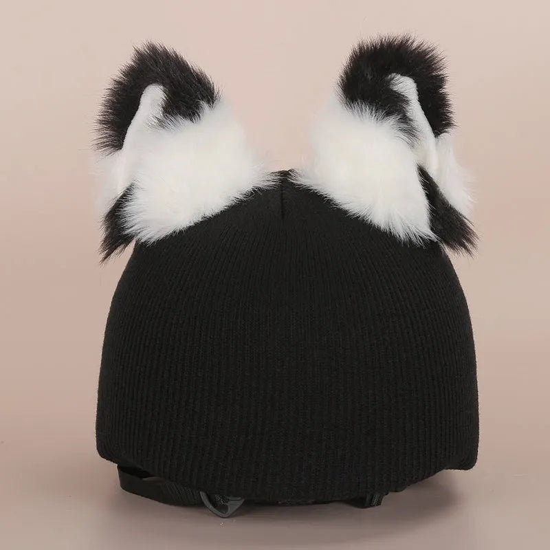 Soft plush cartoon character cover stretched over a pair of black on-ear headphones.