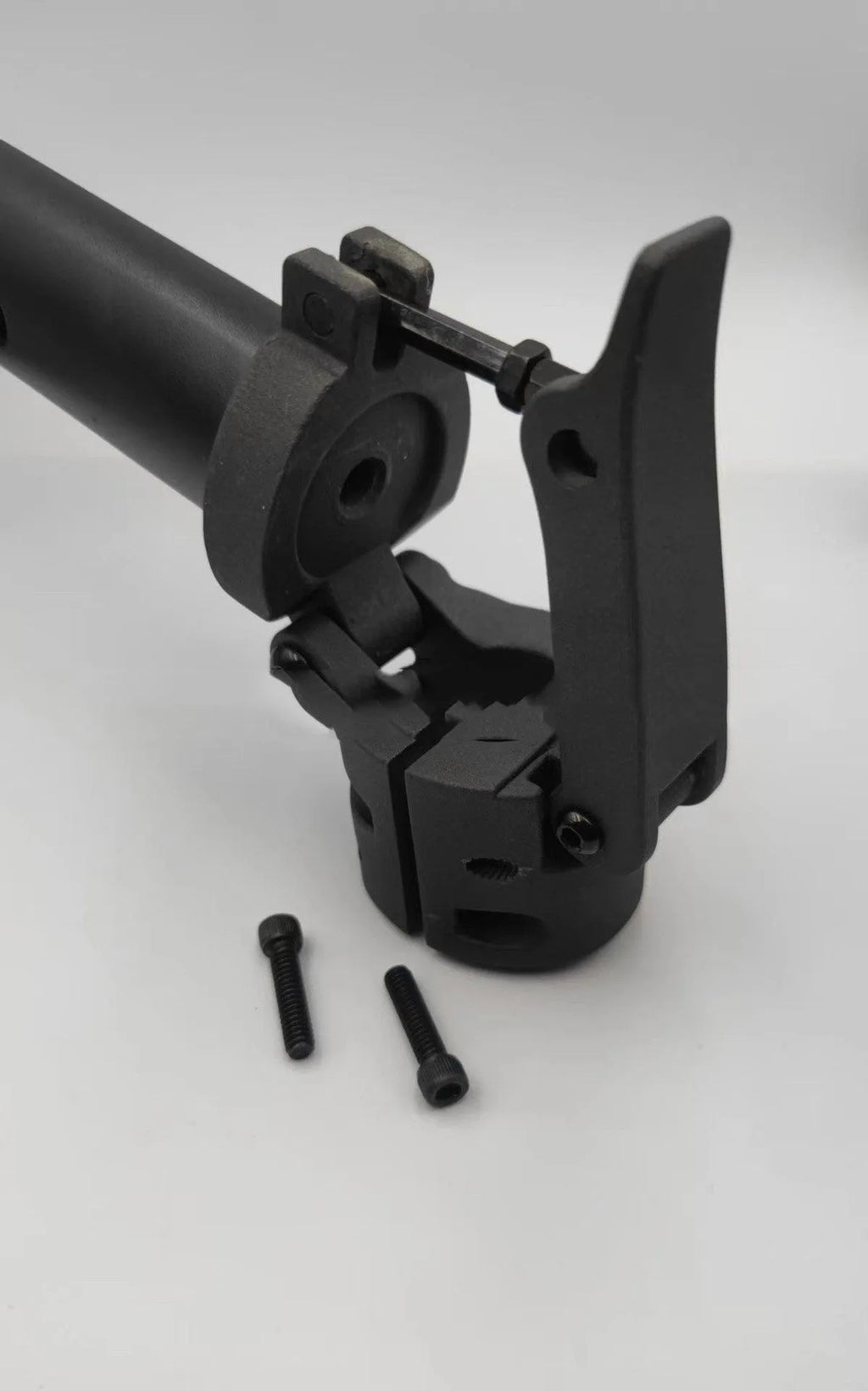 Black steel folding upright handlebar accessory for Nanbo No. 9 electric scooter, shown folded and unfolded.