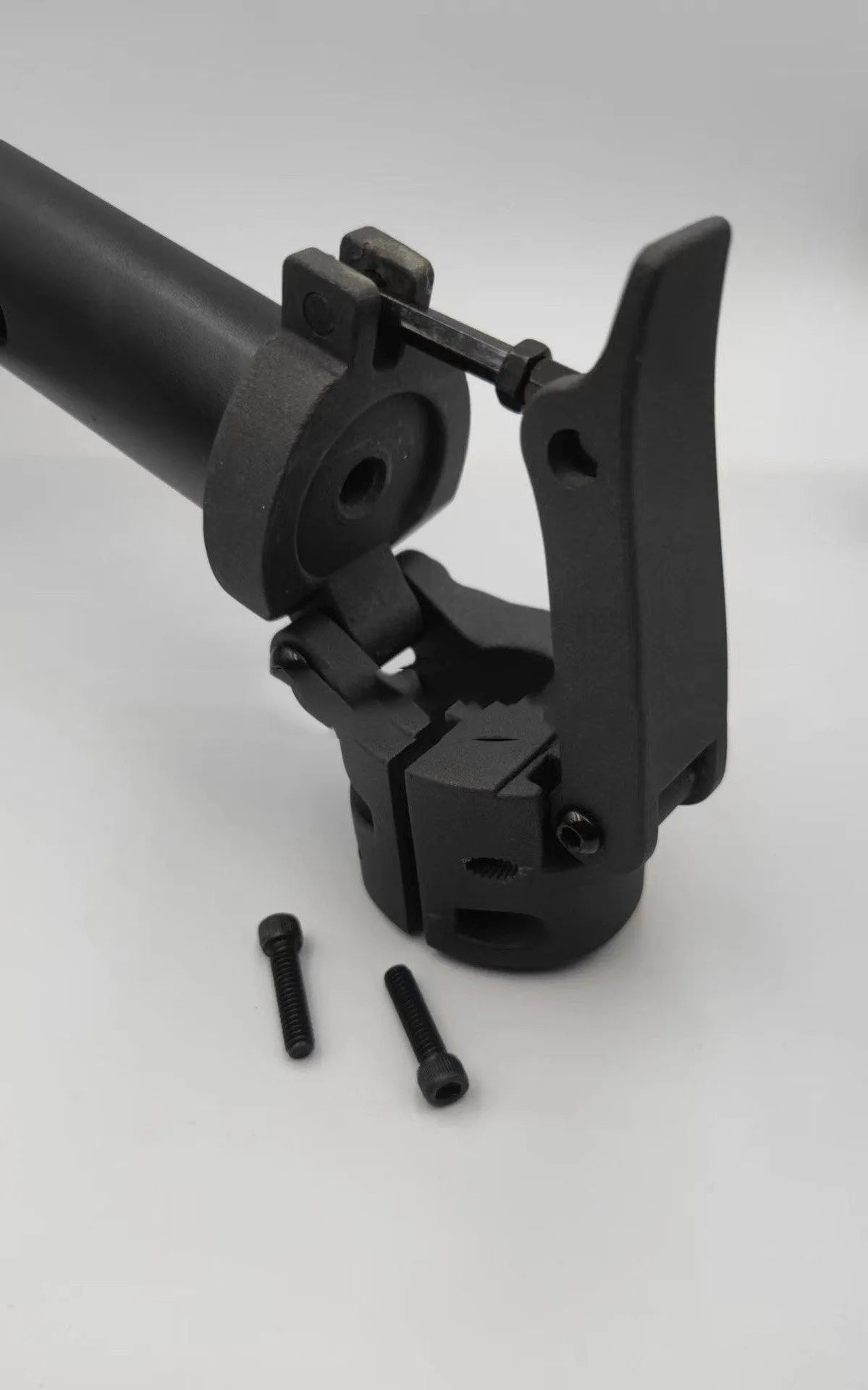 Black steel folding upright handlebar accessory for Nanbo No. 9 electric scooter, shown folded and unfolded.