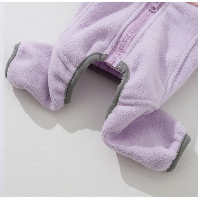 Four-legged fleece pet jacket in colour block design with full zipper and badge patch, sizes S-XXL for cats and small dogs.