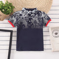 A solid colour short sleeve polo shirt for a young boy, made from soft cotton fabric.