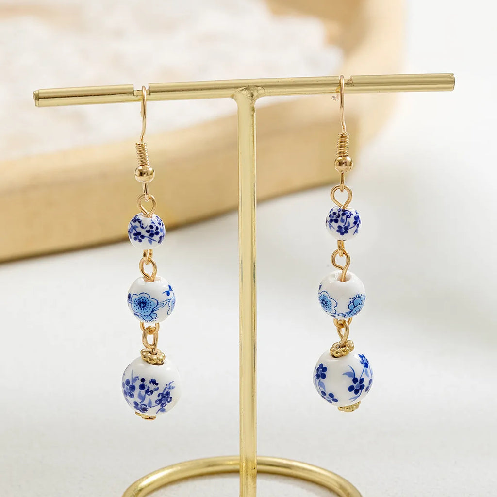 Blue and white porcelain ceramic bead long retro earrings with alloy metal geometric design