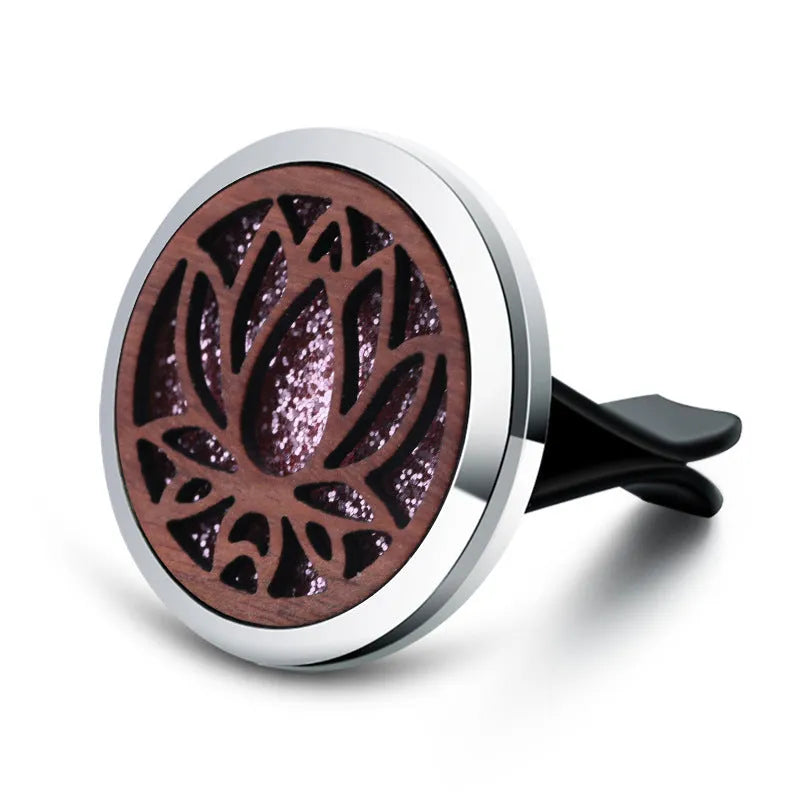Round car vent aromatherapy clip in alloy wood construction showing hollow centre for incense